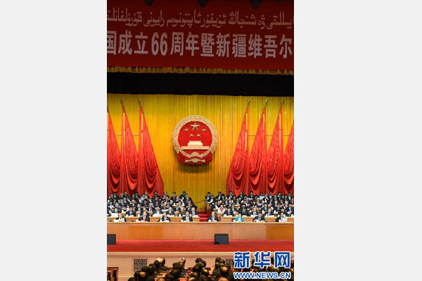 10月1日，慶祝中華人民共和國成立66周年暨新疆維吾爾自治區(qū)成立60周年大會在新疆人民會堂隆重舉行。 新華社記者 高潔 攝 