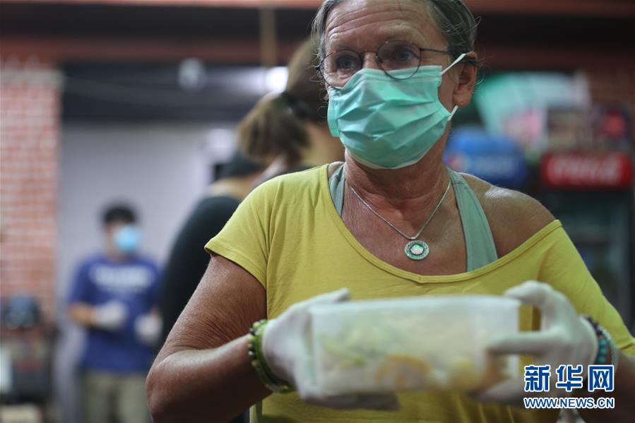 (國際疫情 ·圖文互動)(5)通訊:加德滿都中國人奉獻(xiàn)的“愛心便當(dāng)”