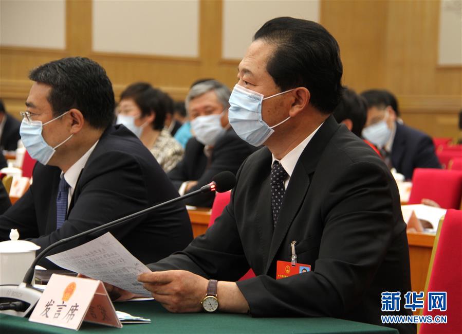 （兩會&middot;熱點畫報）（11）代表委員建言統(tǒng)籌做好經濟社會發(fā)展工作